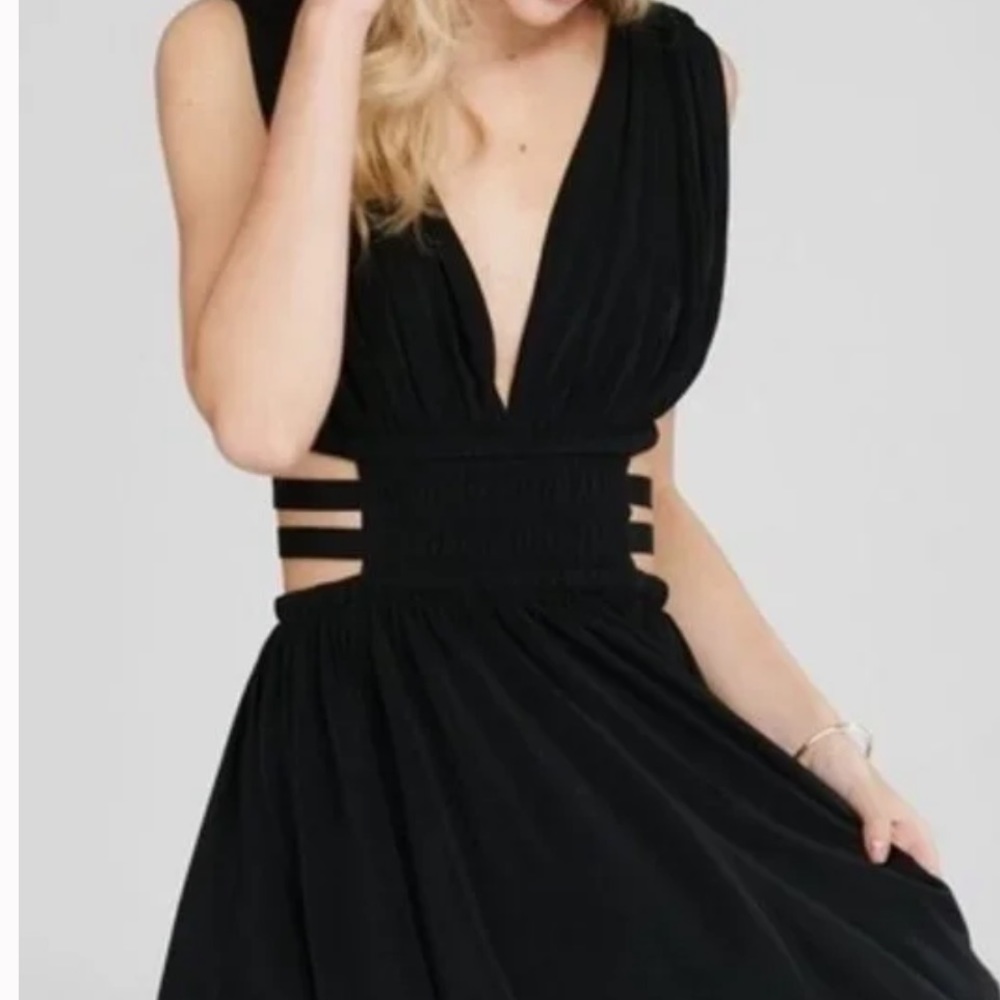 XS Express short black Grecian style dress with cut outs.